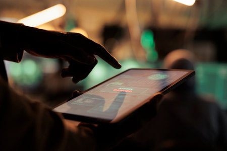 Online spy looking at failed hacking alert on screen, using computer malware and software code to...