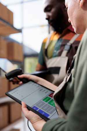 Stockroom supervisors analyzing merchandise report