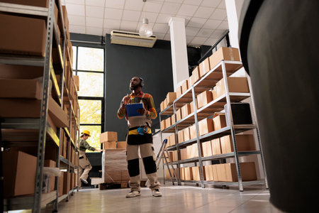 African american worker wearing headset listening musicの写真素材