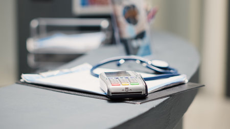 Pos terminal and forms on counterの写真素材