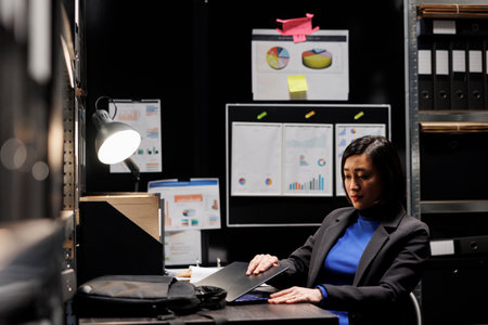 Asian employee clocking out