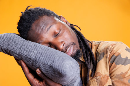 Exhausted adult putting head on pillow