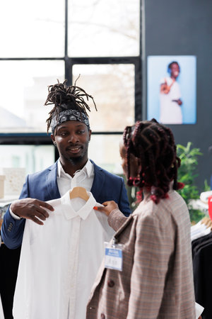 Showroom manager helping stylish customer