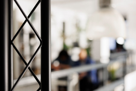 Blurred employees working in open space business officeの写真素材
