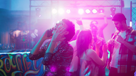 Young woman trying to talk on phone at discotheque, answering phone call on dance floor. Girl having...