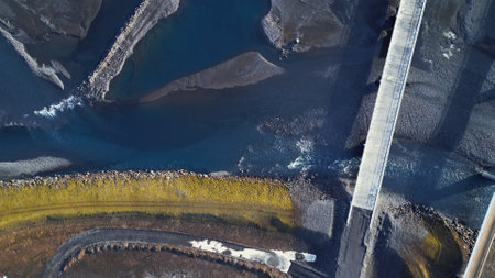 Aerial view of icelandic landscape and black fields, scandinavian scenery with frozen roads and lands in iceland. Beautiful panoramic view of nordic roadside, countryside. Slow motion.の写真素材