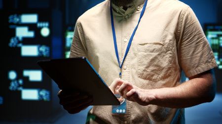 Engineer in data center setting up high bandwidth dedicated multiplayer online gaming servers to...