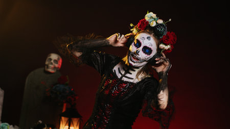 Horror model listening to music and song on headset, using headphones to listen to mp3 sounds in...