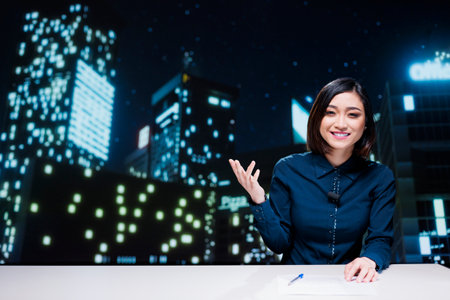 TV show host going live on transmission to create content for global television program, using headlines exclusive from media outlets. Journalist presenter hosting breaking news segment.の写真素材