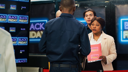 Mad diverse people in line on black friday seasonal sales, arguing with security agent to allow access into department store. Anxious crowd of clients forcing to enter shopping center. Tripod shot.の写真素材