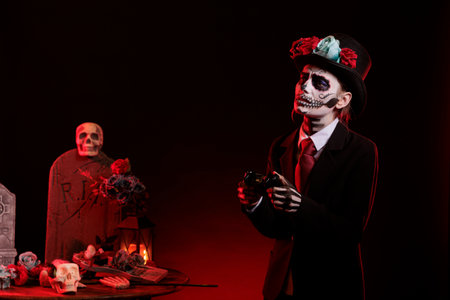 Goddess of death losing at video games play feeling sad, wearing holy day of the dead costume to celebrate mexican tradition. Woman playing online competition with la cavalera catrina make up.の写真素材