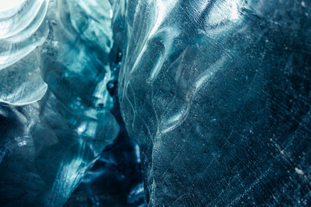 Vatnajokull caves are home to amazing ice formations, including large blue frozen blocks of ice. Due to global warming issues, ice clear glaciers and glacial crevasses disappeared.の写真素材