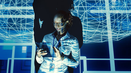 African american tech support woman looking at artificial intelligence human brain simulation hologram. Overseeing manager uses tablet to harness AI technology power, interacting with AR visualizationの写真素材