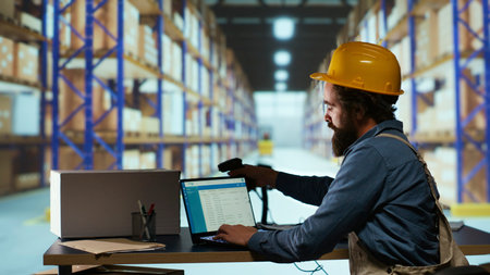 Delivery supervisor scanning barcodes for product logistics, managing delivery requirements with...