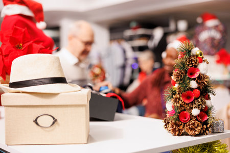 Selective focus of people checking clothes in shopping center boutique, retail store assistant...