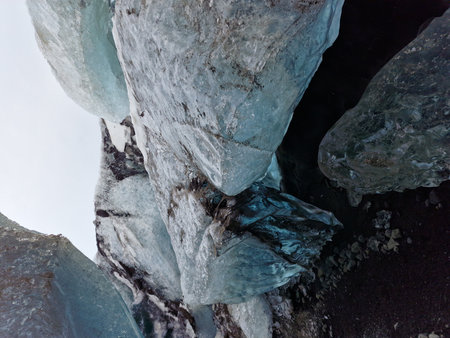 Ice fragments inside vatnajokull crevasse in iceland, freezing cold rocks with transparent structure...