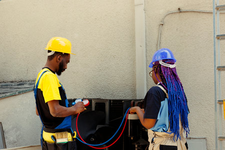 African american coworkers hired after complaints about noisy air conditioner and significant...