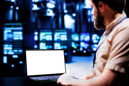 Expert using mock up laptop to evaluate supercomputers with high computing power enabling server...