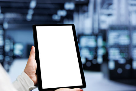 Close up shot of mock up tablet in data center delivering massive computing power, capable of...
