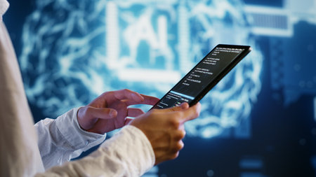 IT developer writing artificial intelligence script code in startup workspace on tablet terminal....