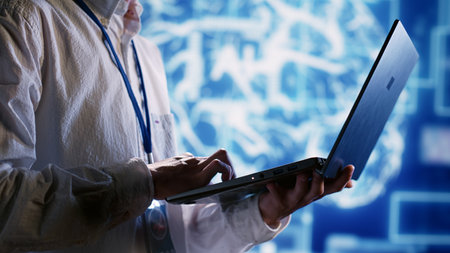 Knowledgeable executive using laptop to maintenance artificial intelligence neural networks made up...