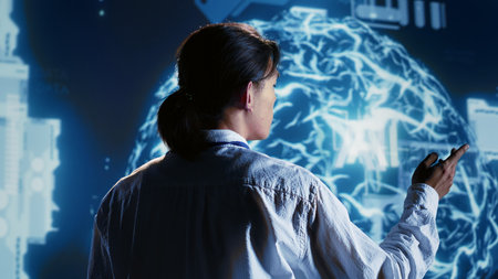 Overseeing manager developing artificial intelligence neural networks architecture inspired by human brain. Meticulous inspector setting up AI machine learning algorithms in high tech startupの写真素材