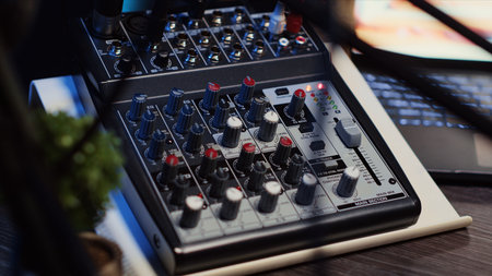 Close up shot of professional analog mixer with mixing channels, onboard effects and quality...