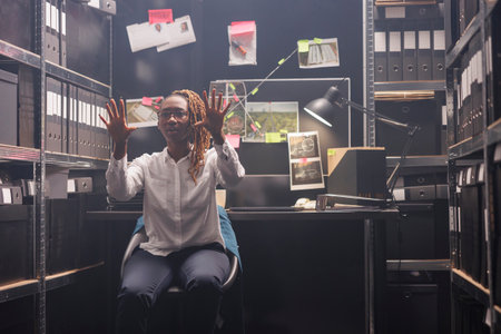 Law enforcement investigator using ar technology to analyze crime scene. African american woman...