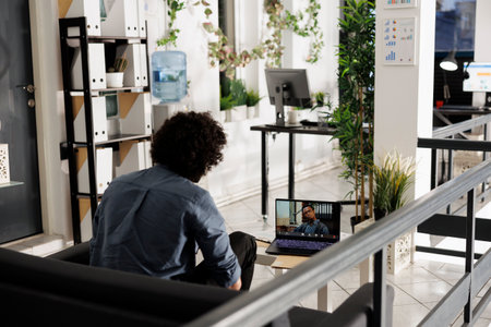 Employee discussing project strategy with executive manager during virtual conference in corporate...
