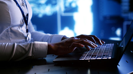 System administrator writing artificial intelligence script code in startup workspace on laptop...