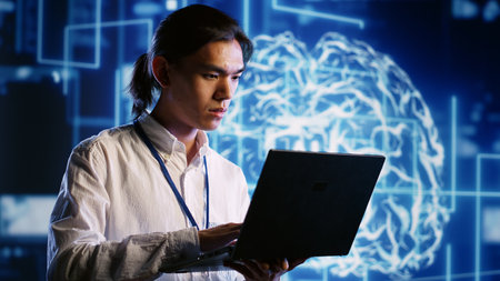 IT practitioner works with artificial intelligence computerized model simulating human brain. Tech savvy inspector overseeing AI machine learning algorithms pattern recognitionの写真素材