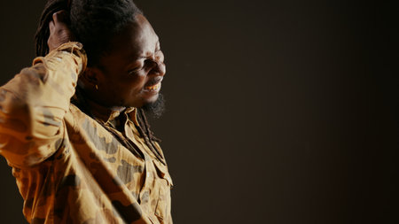 Uncertain person being contemplative and confused on camera, thinking about answer to a question. Unsure clueless adult acting puzzled and reflective, focused guy. Handheld shot.の写真素材