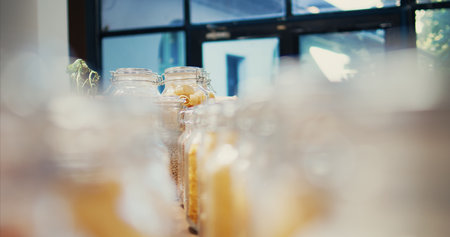 Bulk products in eco friendly zero waste farmers market placed on shelves, nonpolluting organic freshly harvested produce, Advertising sustainable lifestyle and nutrition. Tripod shot. Close up.の写真素材