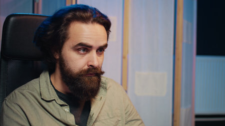 Computer scientist updating artificial intelligence machine learning algorithm, writing binary code scripts. IT specialist in apartment office uses programming to upgrade AI, camera B close upの写真素材