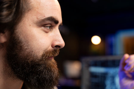 Close up shot of joyful engineer talking with sentient AI becoming superintelligent. Upbeat IT freelancer discussing with self aware artificial intelligence transcending to higher structureの写真素材