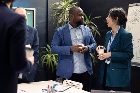 Forecast affiliates meeting in boardroom office to review latest business environment news and progress. Coworkers and general manager training to expand the enterprise globally.の写真素材