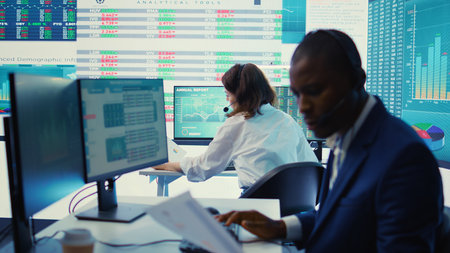 General director examining statistics big data on computer in a control room, makes a briefing...