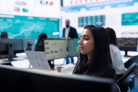 Indian financial consultant ensuring firm success for the stakeholders, presents progress by communicating key performance indicators. Confident employee shares the current situation.の写真素材