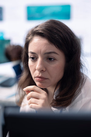 Company employee establishing project details and essential information about achieving business objectives, allocating budget and other resources. Strategic projection on pc.の写真素材