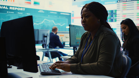 Enterprise manager analyzes annual reports and statistics on a pc, works on creating business strategies and goals. Analyst studying market dynamics and organizational progress. Camera B.の写真素材