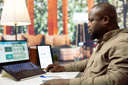 General manager studying sales statistics to evaluate supply and demand, finding ways to increase...
