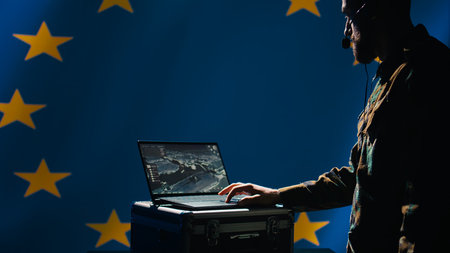 European Union alliance air defense early warning systems operator evaluating incoming enemy aerial attacks. EU counterintelligence division agent maintains air space superiority with radar, camera Bの写真素材