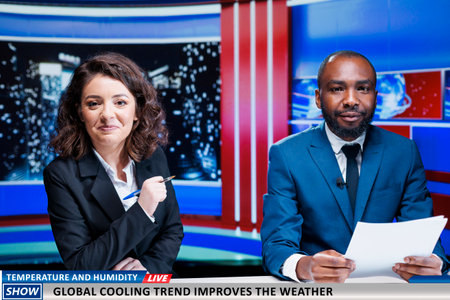 Presenters talk about new weather heat, experts launching global cooling trend to improve temperature during summer. Team of diverse newscasters present modern alternatives on live broadcast.の写真素材