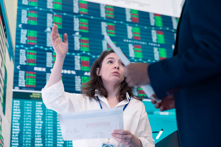 Business partners reviewing latest budgeting plans on big screen, sharing ideas and updates to ensure organizational progress. Forecast affiliates making decisions for a new fruitful project.の写真素材