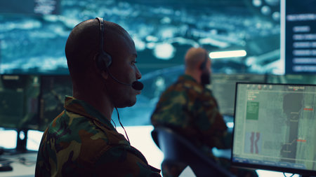 Military personnel execute electronic intelligence gathering missions to intercept enemy communications or warships gps positions. Soldiers conducting reconnaissance operations. Camera A.の写真素材