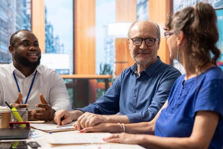 Elderly people consulting a financial advisor about their retirement planning, long term financial...