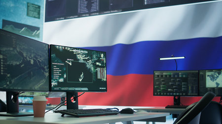 Empty russian military control center with a big screen presenting the national flag, spreading fake news and propaganda to brainwash the people. Inflicting fear among the population. Camera B.の写真素材