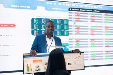 Staff members from a business enterprise discussing details and progress in a new project during a corporate meeting. Company experts getting informed about marketing developments.の写真素材