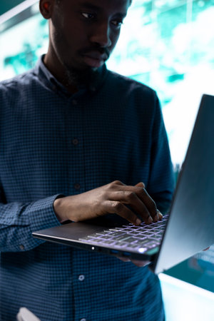Governmental hackers team working on digital security and cyber defense measures, using pc and big screen. Experts focusing on cyber operations, network security and server protection.の写真素材