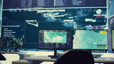 Government anti terrorism operation room equipped with a big display and surveillance on satellite radar cctv used for reconnaissance. Empty military command center with high tech.の写真素材
